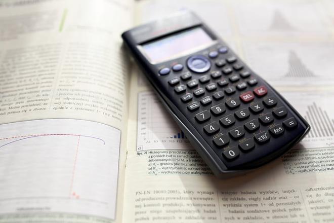 Calculator on a statistics textbook.